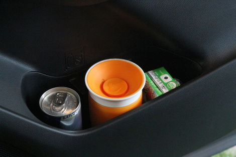 It won’t hold a regular can or bottle, but the third bin will hold a juice box.